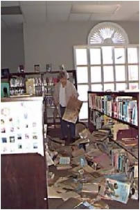 Doris Hildreth Cooper cleans up at the Elba (AL) Public Library 3/9/98. Credit: Jocelyn Augustino from FEMA photo library.